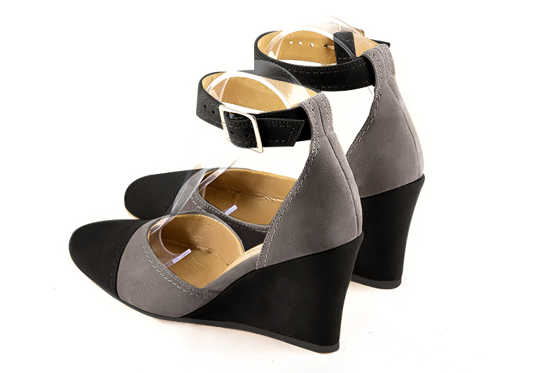 Matt black and pebble grey women's open side shoes, with a strap around the ankle. Round toe. High wedge heels. Rear view - Florence KOOIJMAN